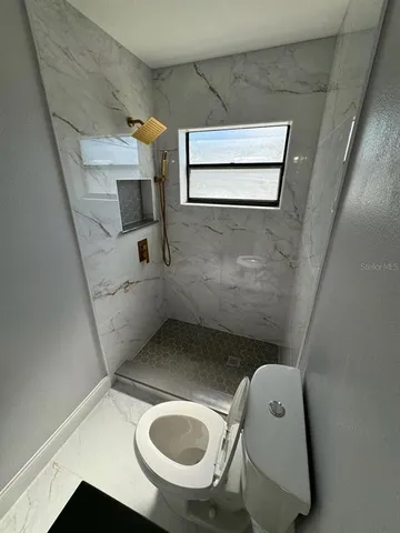 a bathroom with a sink a mirror and vanity
