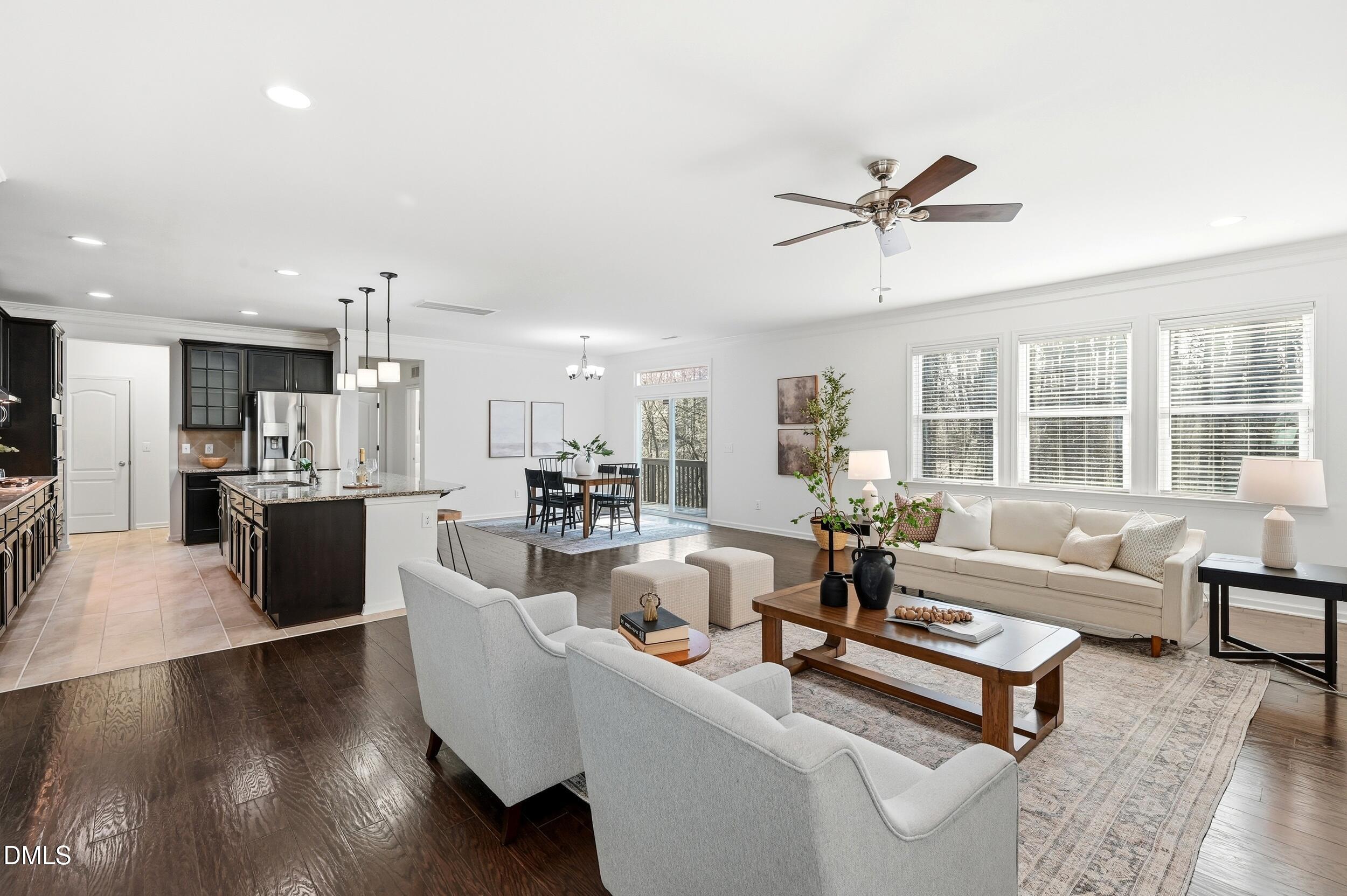 1037 Bender Ridge Drive Morrisville, NC 27560 - Photo 10 of 48 a living room with furniture wooden floor and a table