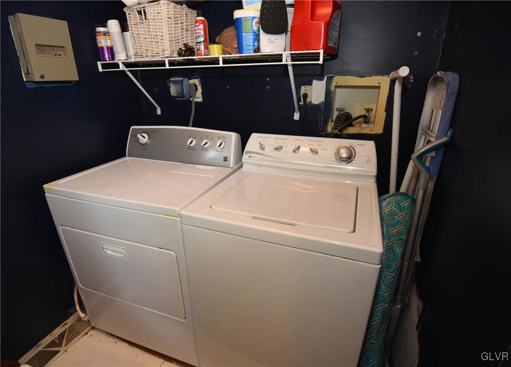 4036 Hollo Road Easton, PA 18045 - Photo 32 of 46 1st level laundry room with shelving; washer/dryer