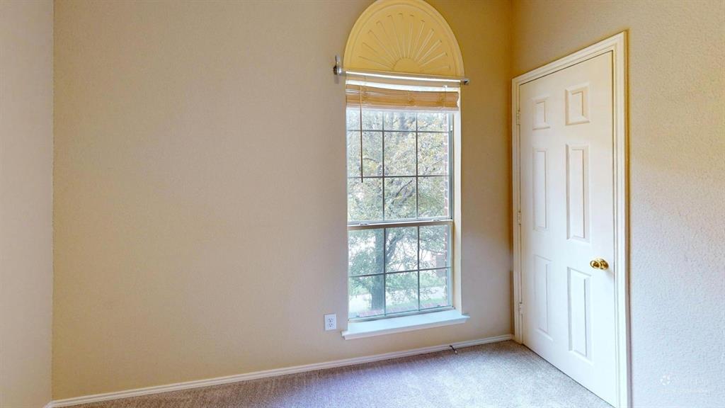 8012 Spring Peaks Drive Plano, TX 75025 - Photo 17 of 21 an empty room with windows
