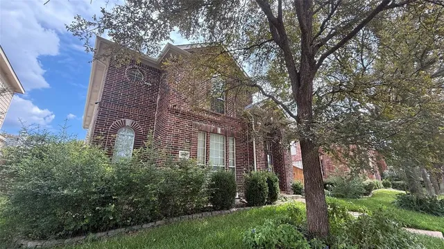 a backyard of a building with trees