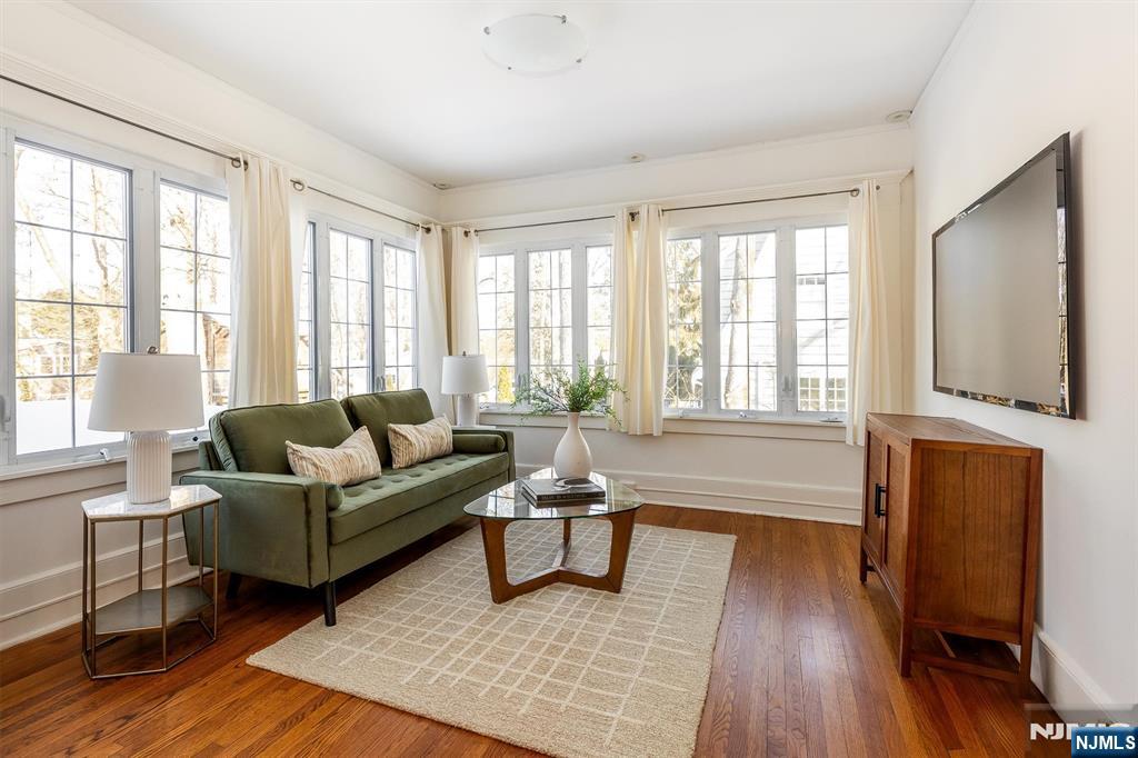 166 Montclair Avenue Montclair, NJ 07042 - Photo 22 of 38 a living room with furniture and a flat screen tv