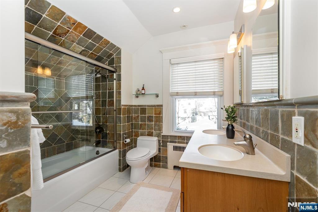 166 Montclair Avenue Montclair, NJ 07042 - Photo 23 of 38 a bathroom with a sink toilet and shower