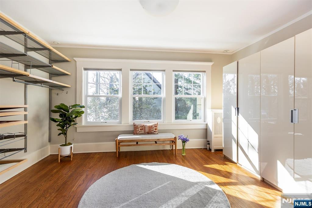 166 Montclair Avenue Montclair, NJ 07042 - Photo 24 of 38 a spacious bedroom with a bed and a couch