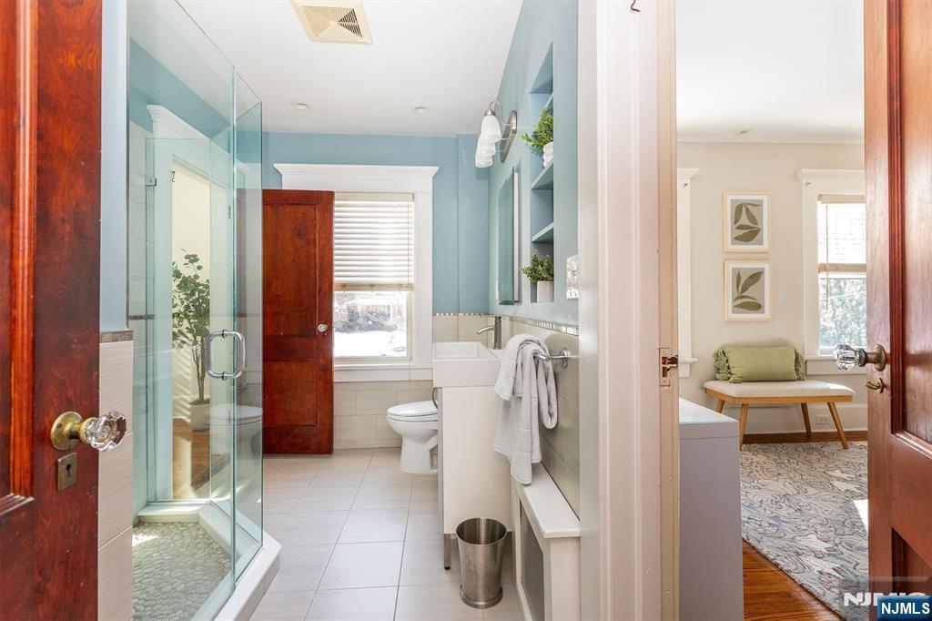 166 Montclair Avenue Montclair, NJ 07042 - Photo 26 of 38 a living room with furniture and a large window