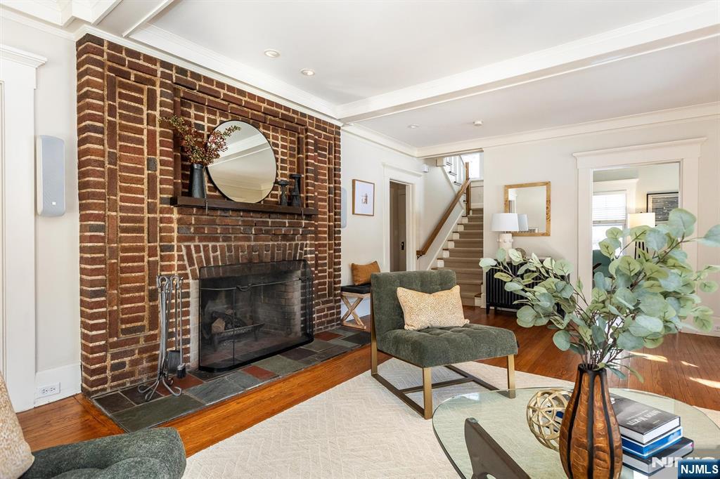 166 Montclair Avenue Montclair, NJ 07042 - Photo 5 of 38 a living room with furniture and a fireplace