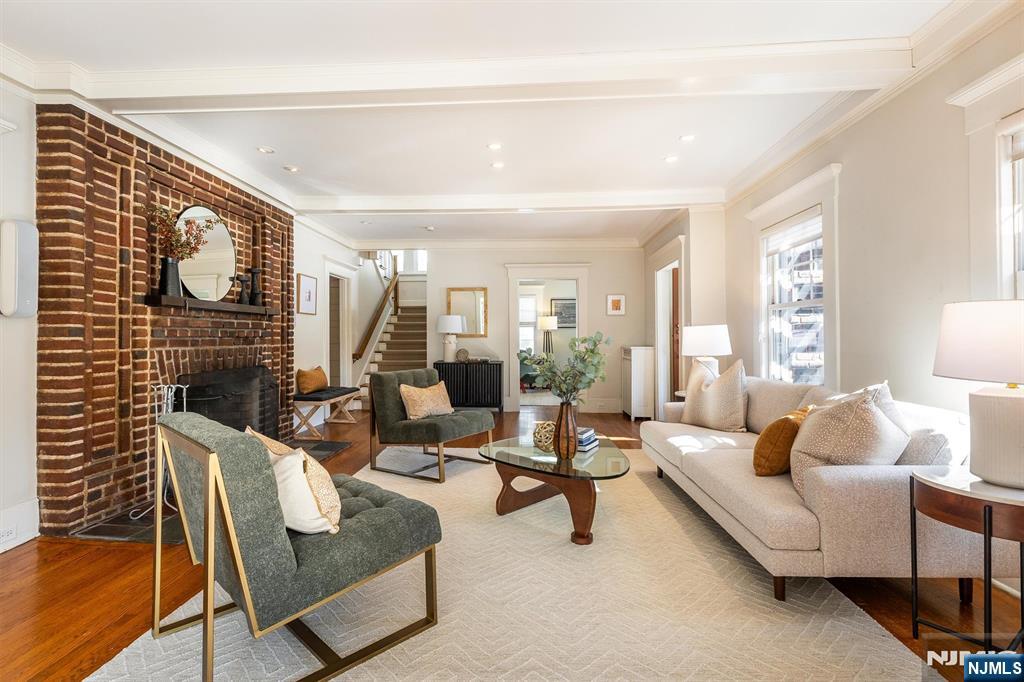 166 Montclair Avenue Montclair, NJ 07042 - Photo 6 of 38 a living room with furniture and a lamp