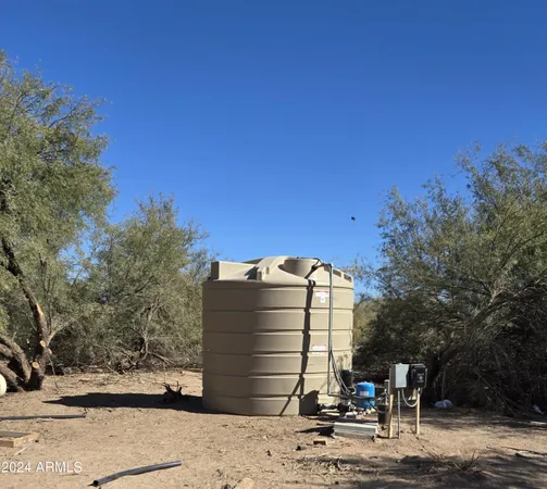 a view of a road with a building in the background