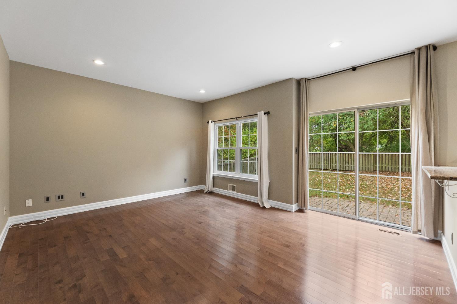 2 Rider Terrace Princeton, NJ 08540 - Photo 14 of 40 an empty room with wooden floor and windows
