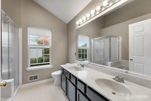 a bathroom with a bathtub and a shower