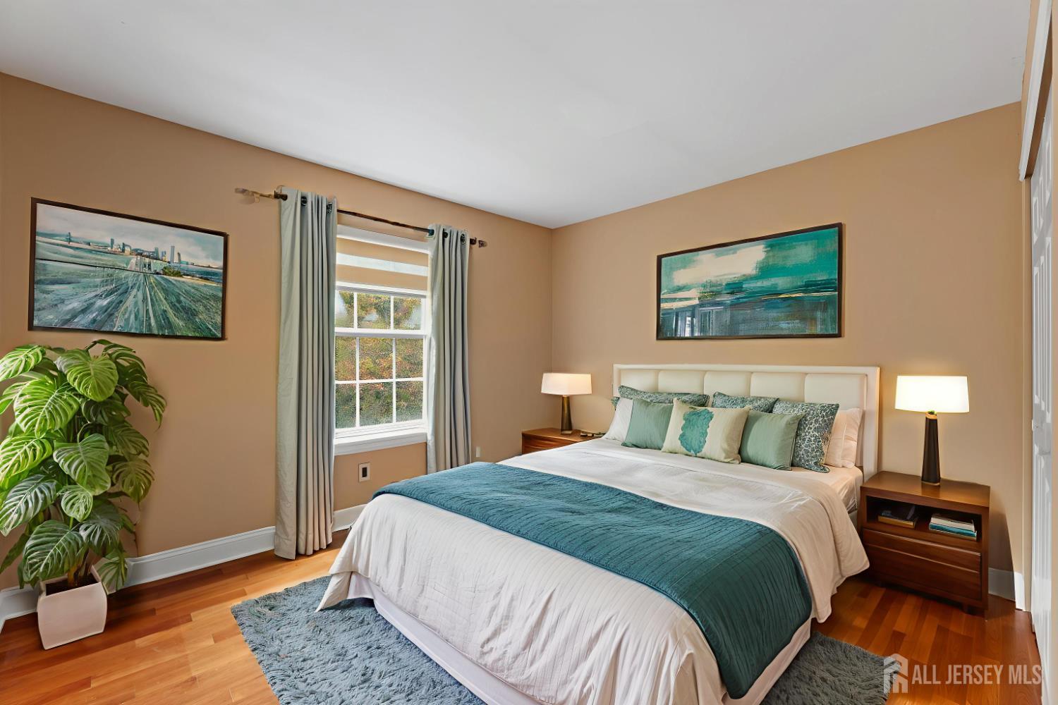 2 Rider Terrace Princeton, NJ 08540 - Photo 29 of 40 a bedroom with a bed and a potted plant