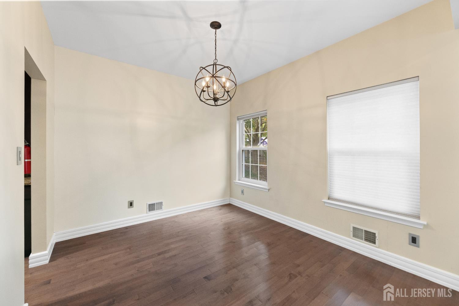 2 Rider Terrace Princeton, NJ 08540 - Photo 7 of 40 an empty room with wooden floor and windows