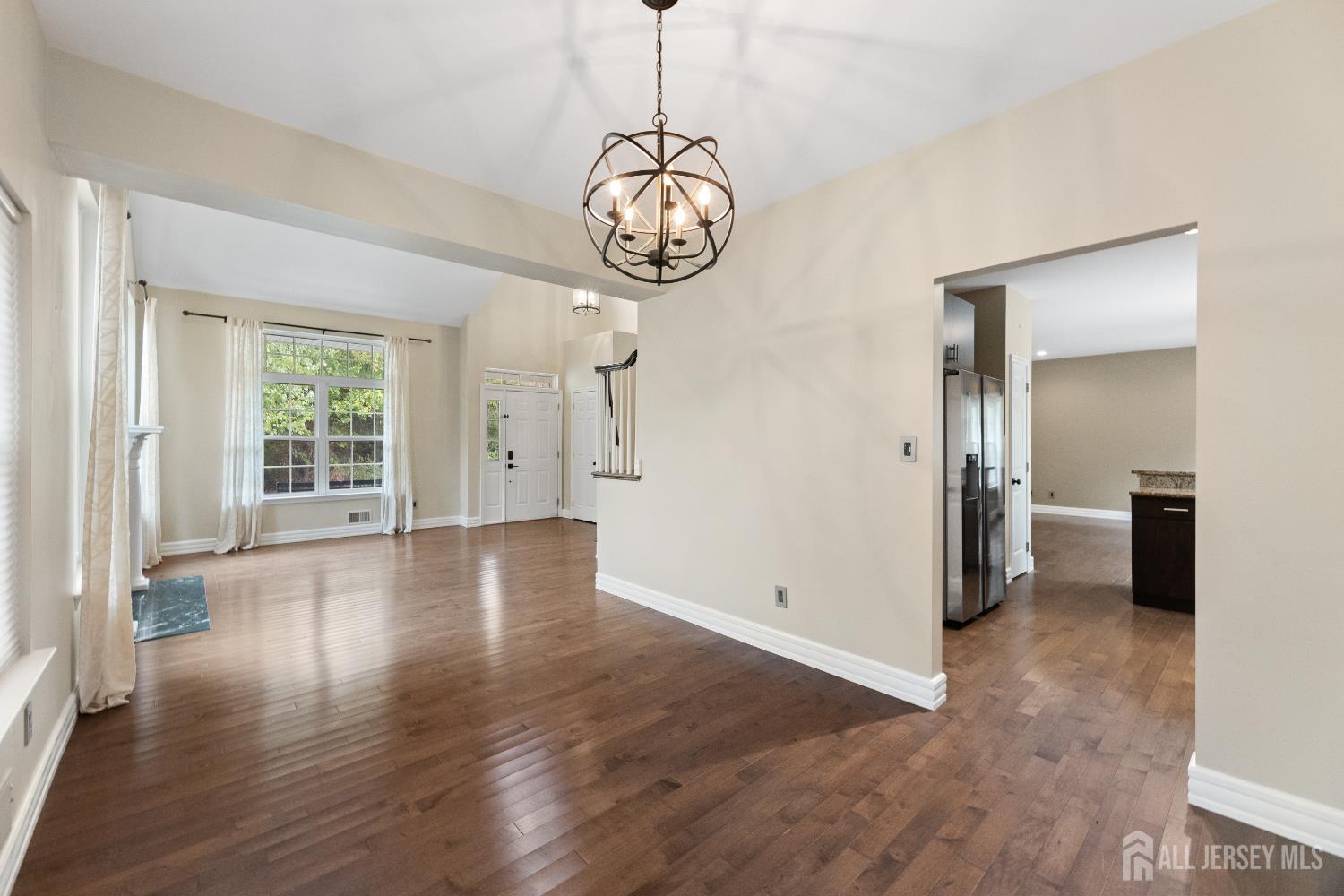2 Rider Terrace Princeton, NJ 08540 - Photo 8 of 40 a view of an empty room with wooden floor and a window