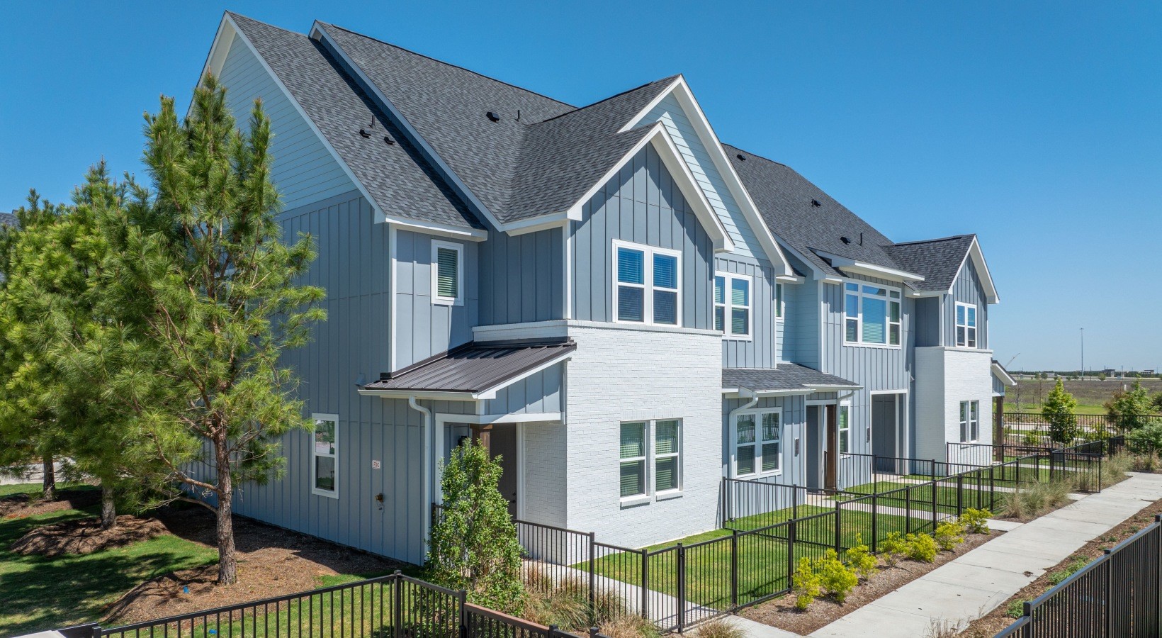 10503 Peek Road, Unit 2502 Cypress, TX 77433 - Photo 1 of 10 a front view of a house with garden
