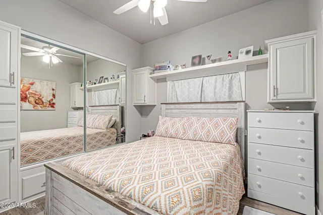 a bed room with a bed and a cabinets