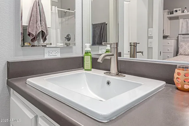 a bathroom with a sink and a mirror