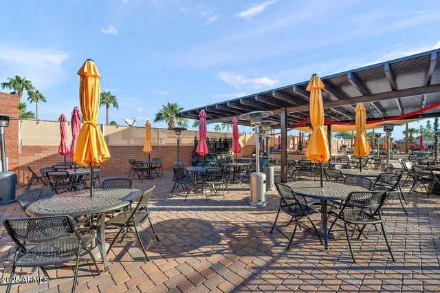 a view of a dinning table and chairs in the patio