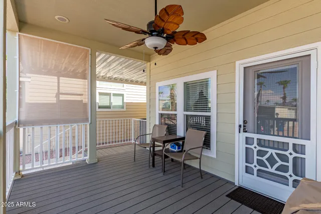 a view of a livingroom with furniture and a window
