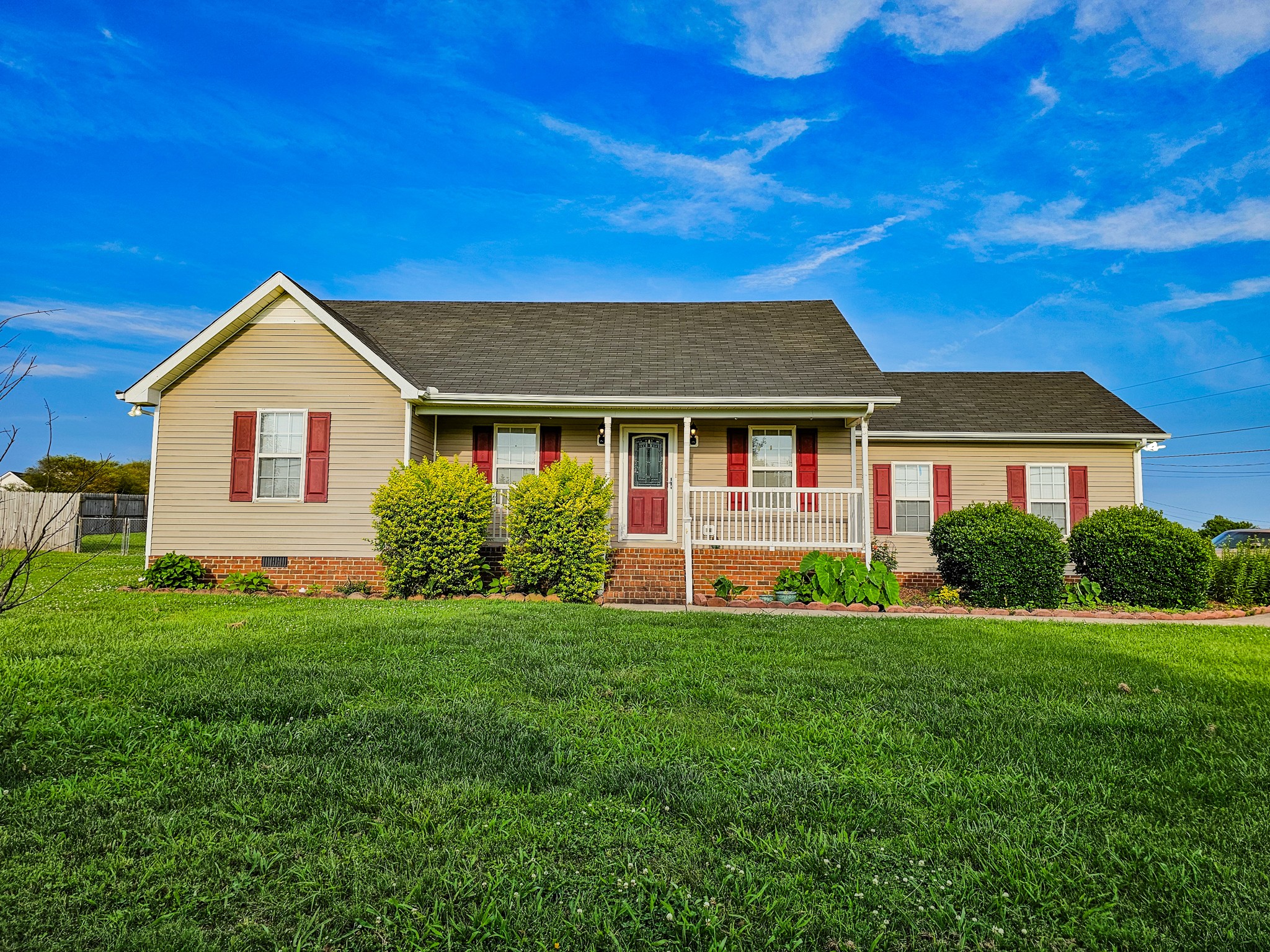 1135 County Line Road Bell Buckle, TN 37020 - Photo 1 of 16 a view of a house with a big yard potted plants and large tree