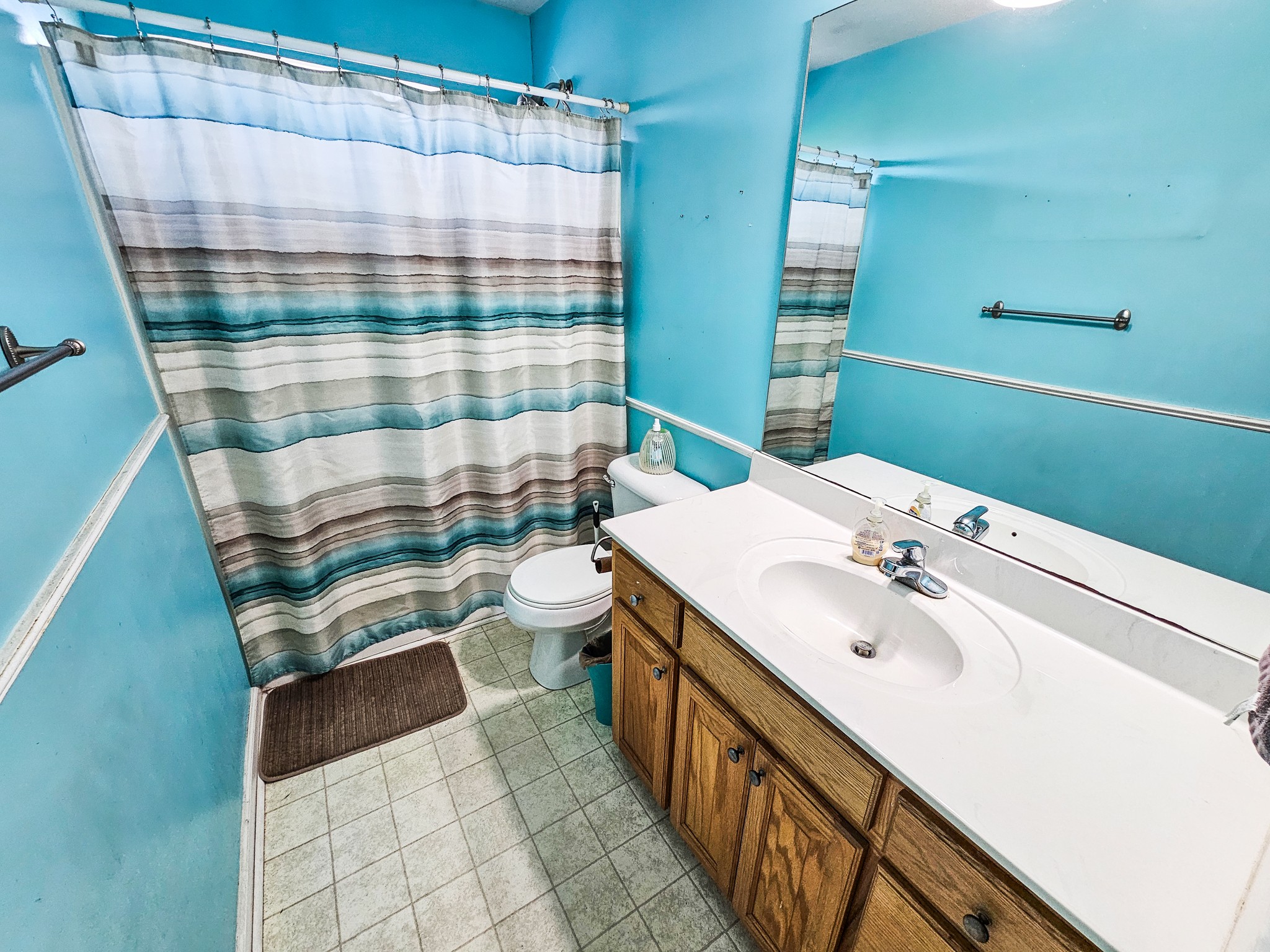 1135 County Line Road Bell Buckle, TN 37020 - Photo 12 of 16 a bathroom with a sink a toilet and shower