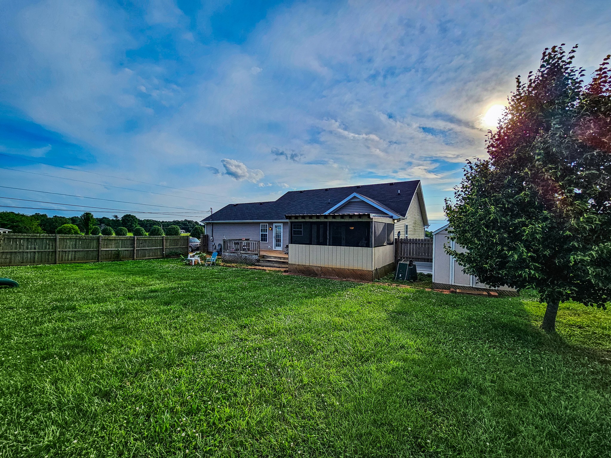 1135 County Line Road Bell Buckle, TN 37020 - Photo 4 of 16 a view of a house with a big yard plants and large trees