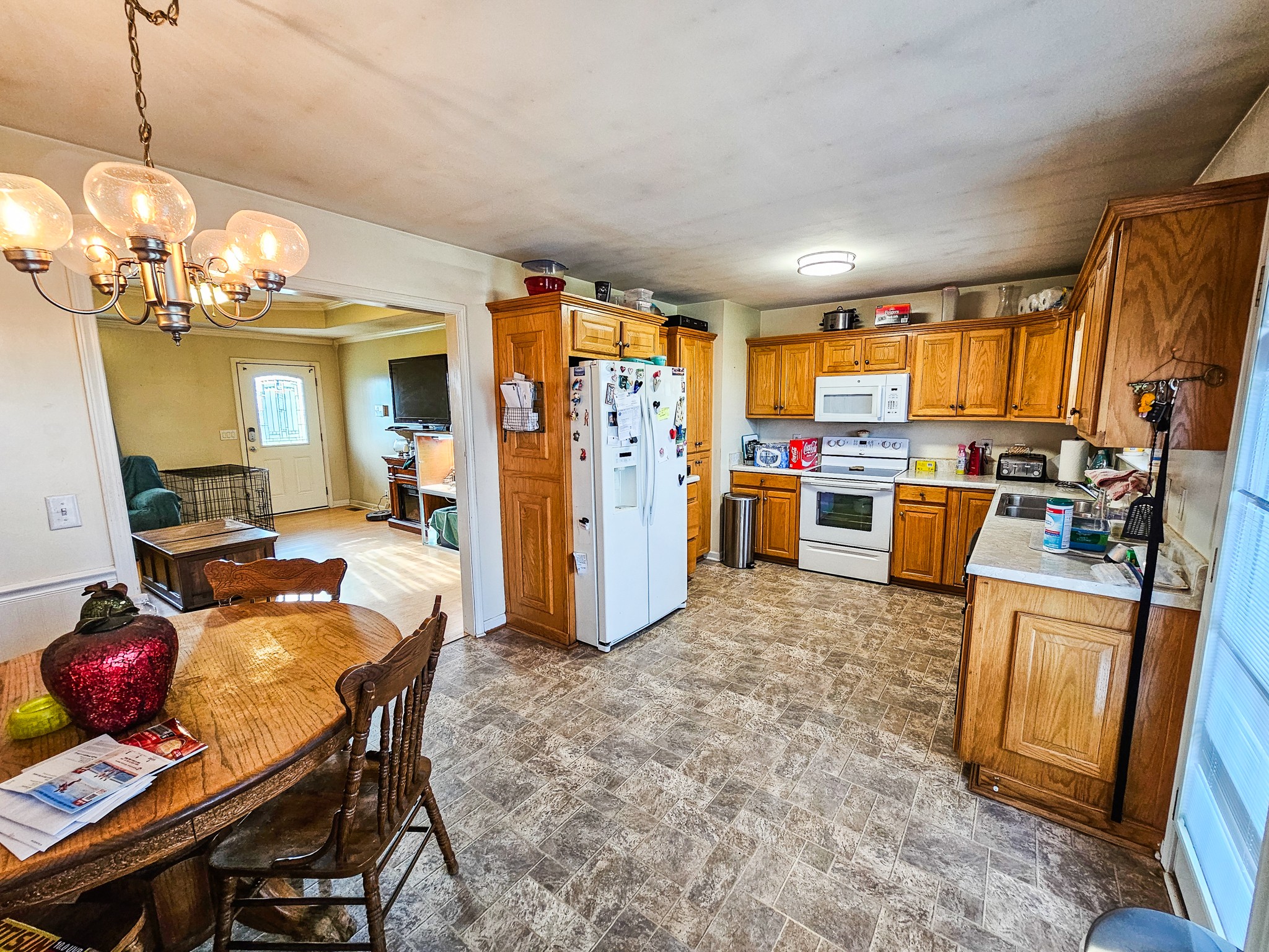 1135 County Line Road Bell Buckle, TN 37020 - Photo 7 of 16 a view of a dining room with furniture window and wooden floor
