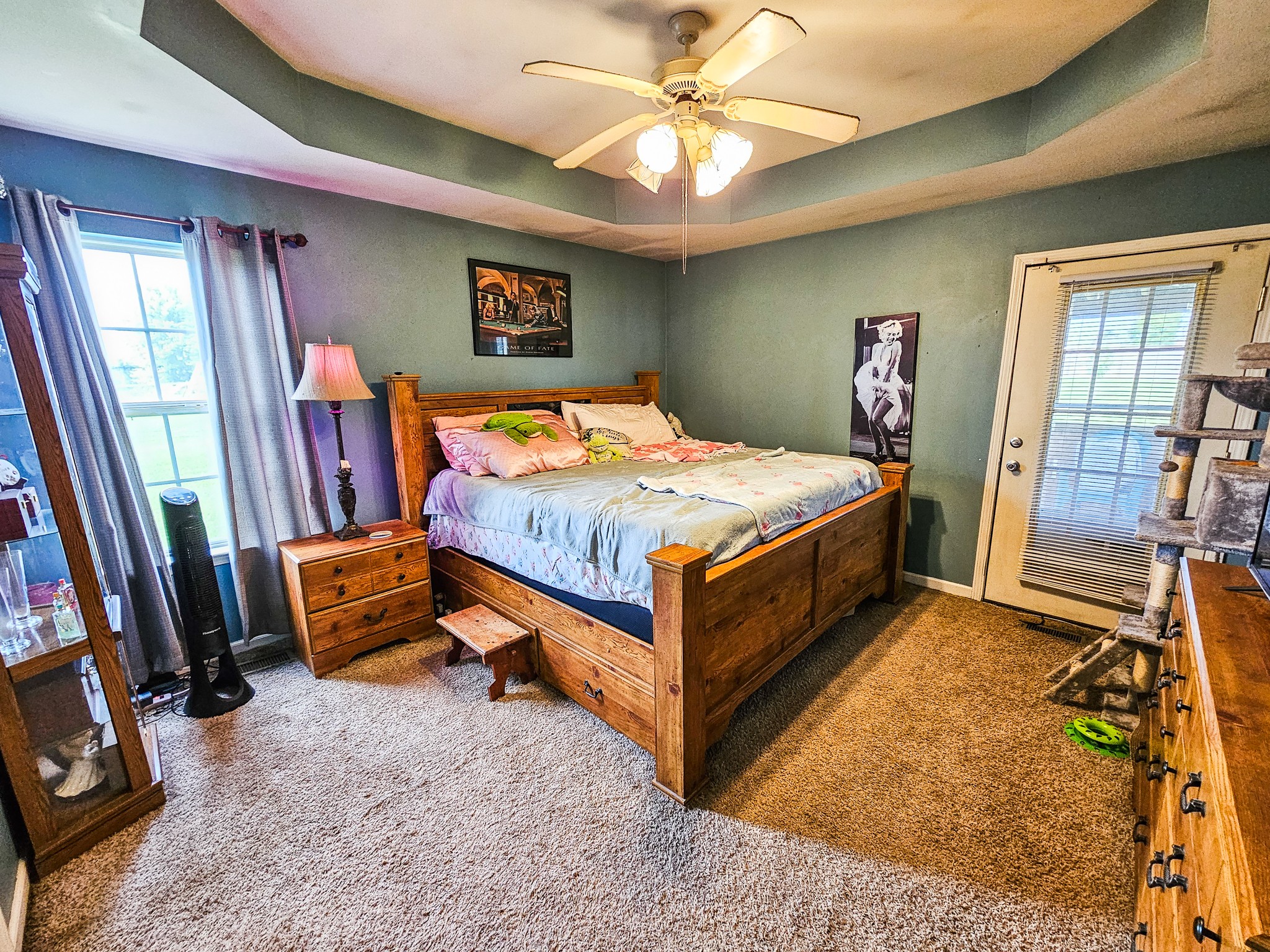1135 County Line Road Bell Buckle, TN 37020 - Photo 10 of 16 a bedroom with a bed and a chandelier