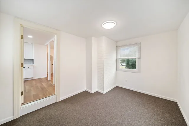 a view of an empty room and window