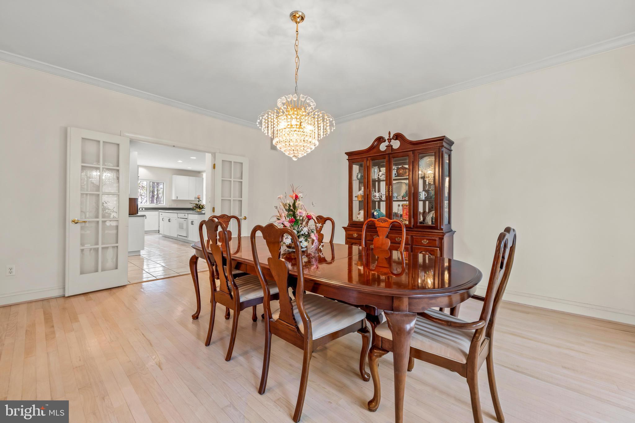 13019 Jerome Jay Drive Cockeysville, MD 21030 - Photo 21 of 61 a view of a dining room with furniture wooden floor and chandelier