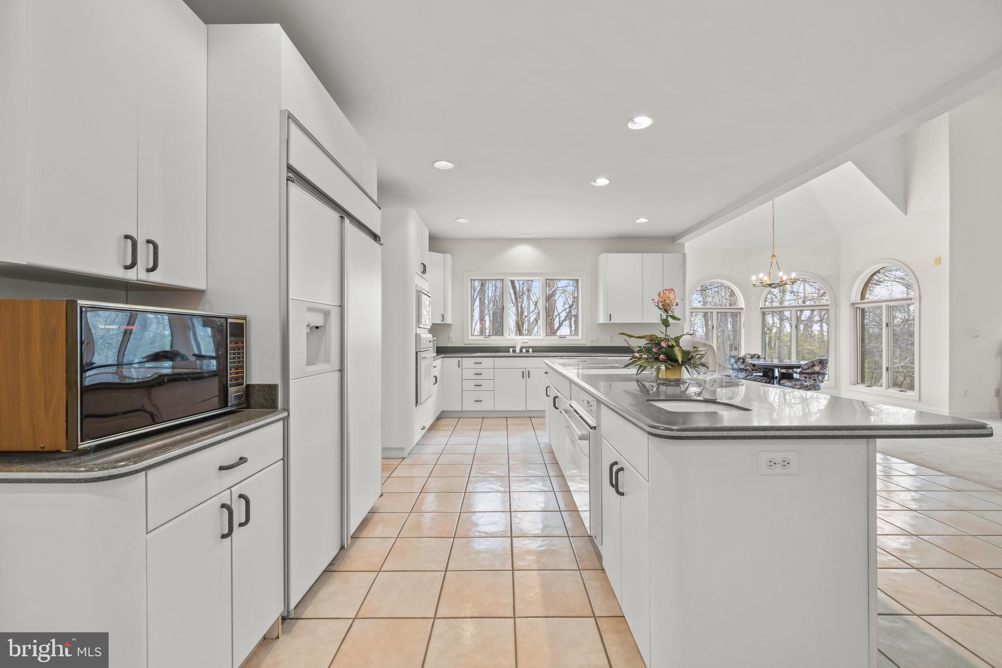 13019 Jerome Jay Drive Cockeysville, MD 21030 - Photo 25 of 61 a kitchen with stainless steel appliances granite countertop a sink and cabinets
