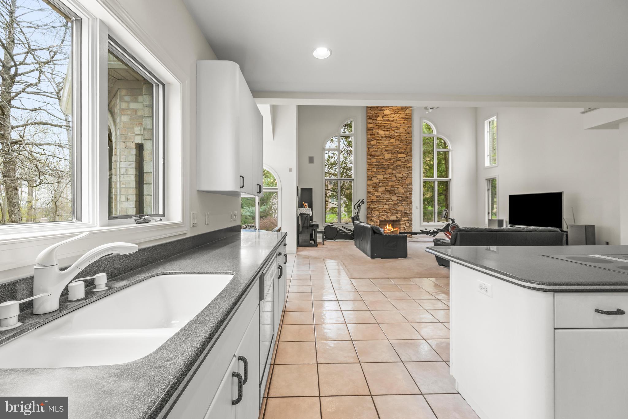 13019 Jerome Jay Drive Cockeysville, MD 21030 - Photo 29 of 61 a spacious bathroom with a granite countertop tub a sink and a large mirror