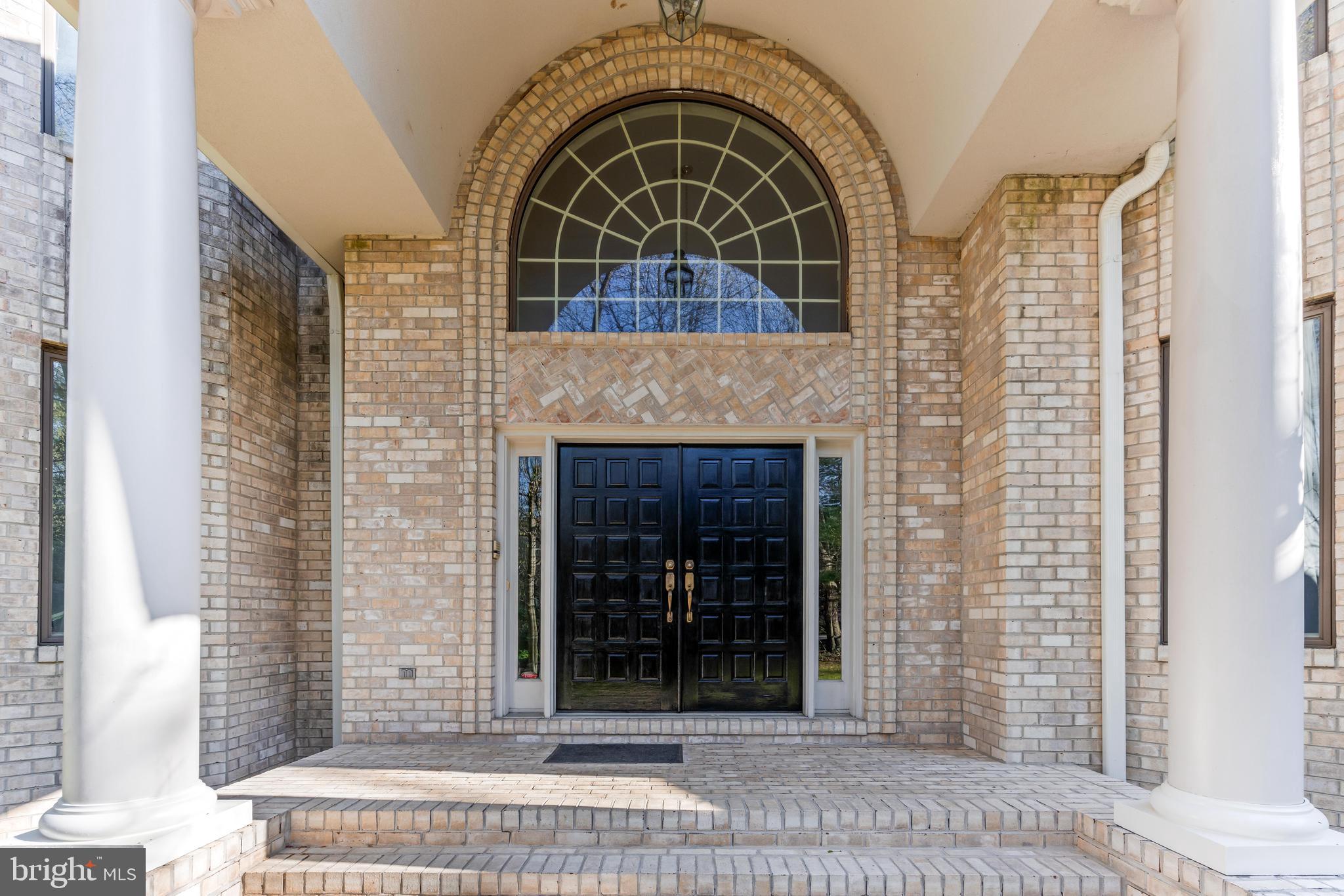 13019 Jerome Jay Drive Cockeysville, MD 21030 - Photo 4 of 61 a view of a brick house with a large windows