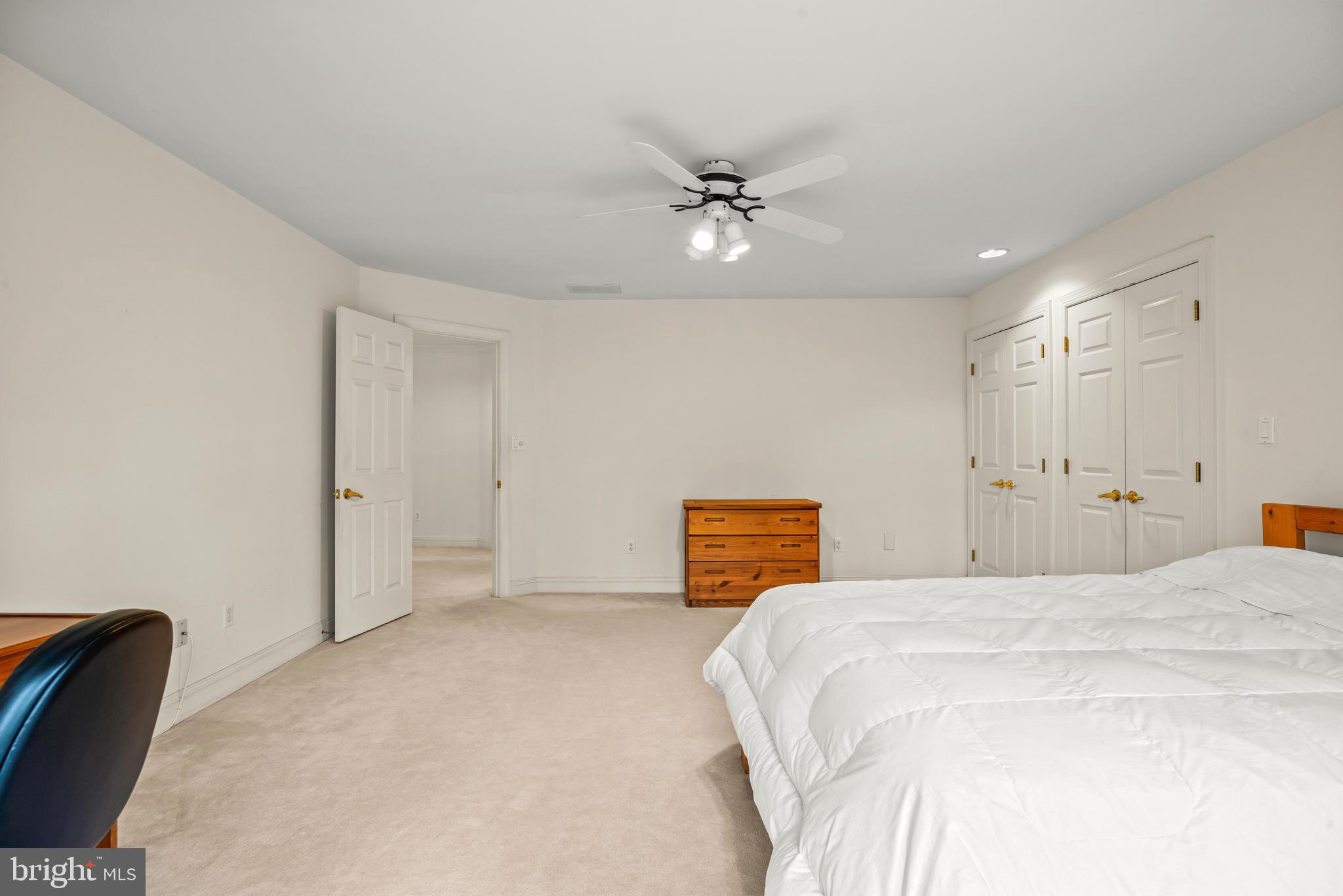 13019 Jerome Jay Drive Cockeysville, MD 21030 - Photo 47 of 61 a bedroom with a bed and a chandelier