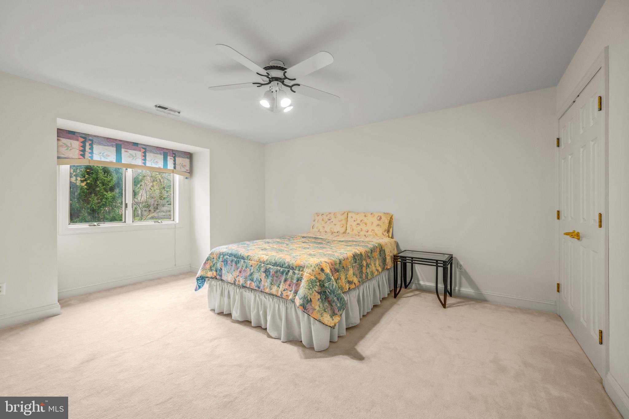 13019 Jerome Jay Drive Cockeysville, MD 21030 - Photo 52 of 61 a spacious bedroom with a bed and a window