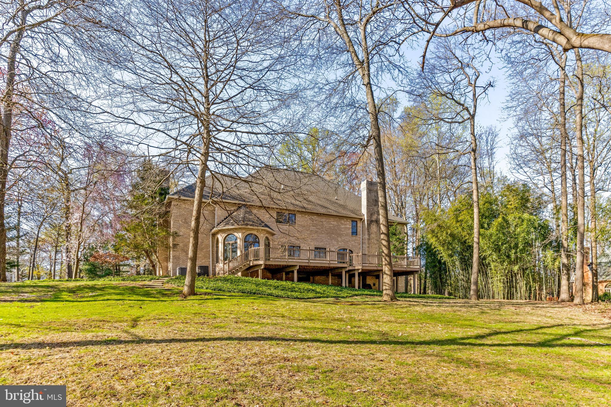 13019 Jerome Jay Drive Cockeysville, MD 21030 - Photo 8 of 61 a view of a white house in a big yard with large trees