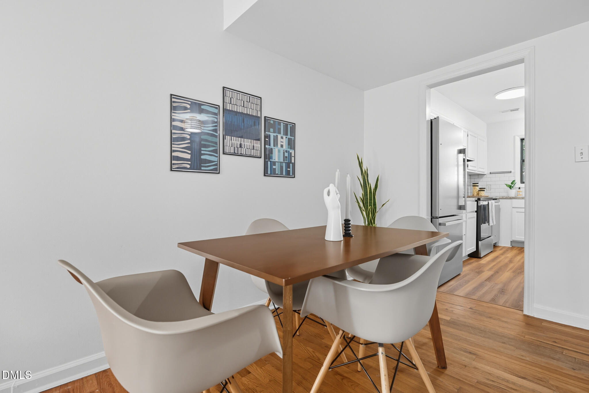 105 Fidelity Street, Unit B9 Carrboro, NC 27510 - Photo 14 of 50 a view of a dining room with furniture and wooden floor