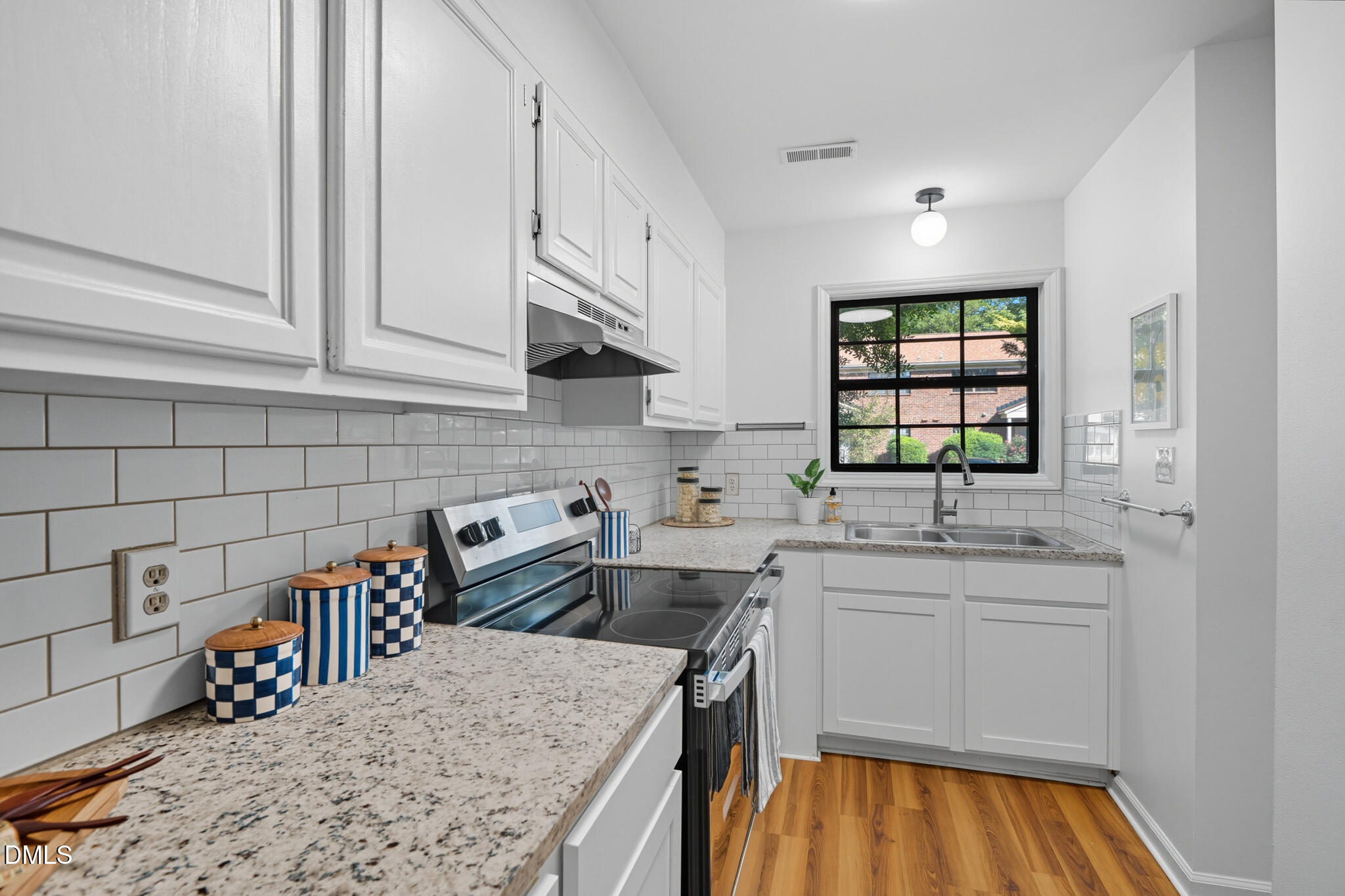 105 Fidelity Street, Unit B9 Carrboro, NC 27510 - Photo 18 of 50 a kitchen with stainless steel appliances granite countertop a sink stove and cabinets