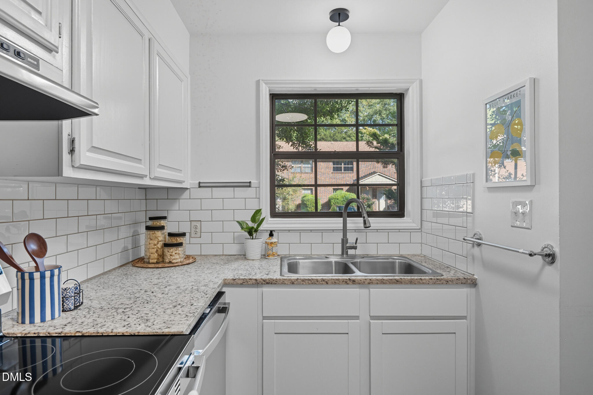105 Fidelity Street, Unit B9 Carrboro, NC 27510 - Photo 19 of 50 a kitchen with granite countertop a sink and a window