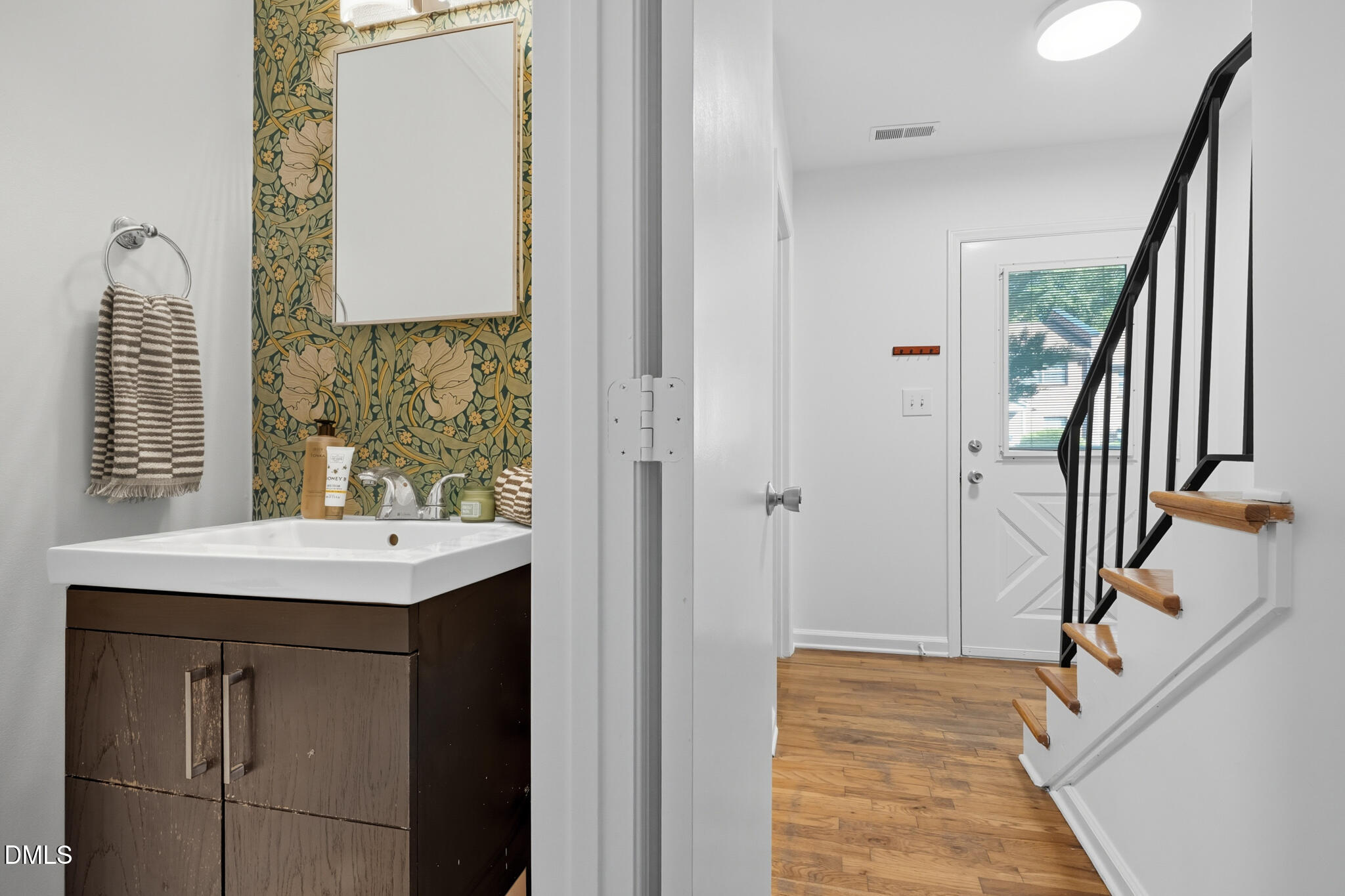 105 Fidelity Street, Unit B9 Carrboro, NC 27510 - Photo 22 of 50 a bathroom with a sink a mirror and shower