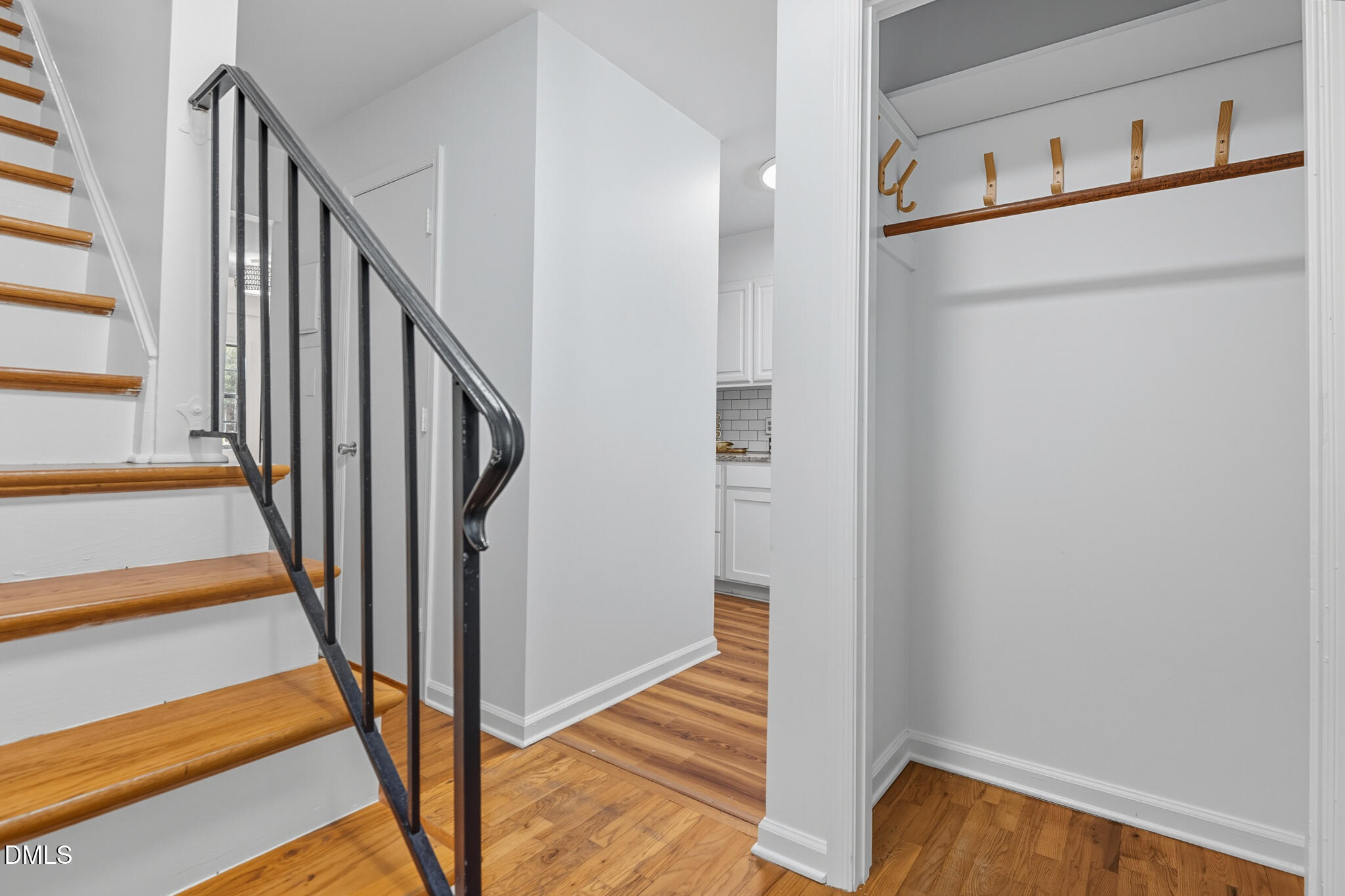 105 Fidelity Street, Unit B9 Carrboro, NC 27510 - Photo 23 of 50 a view of a hallway with wooden floor and staircase
