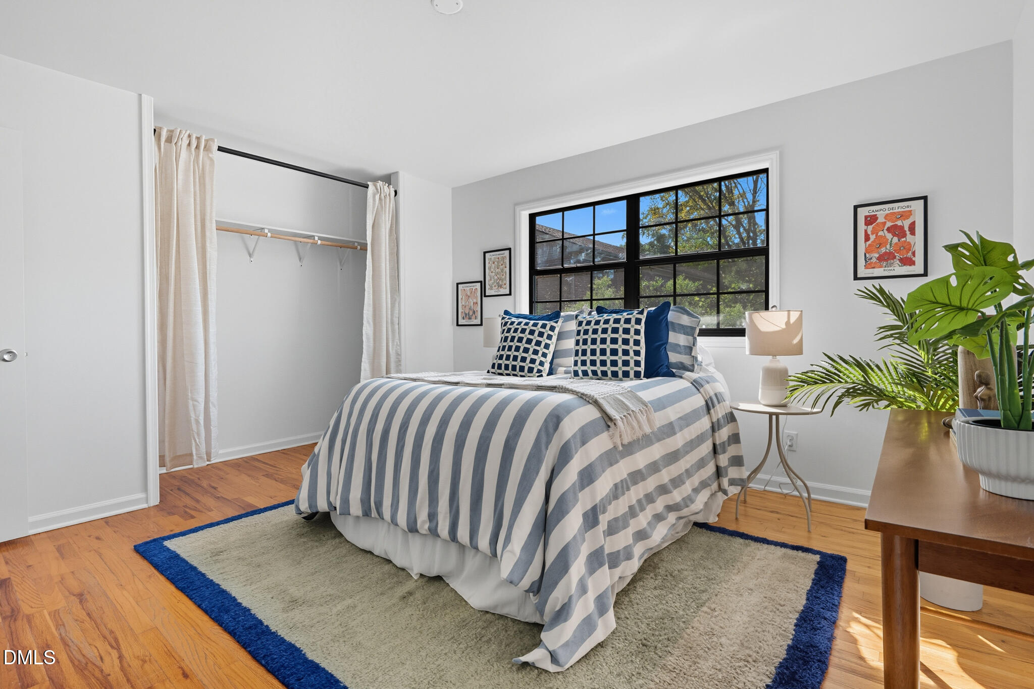 105 Fidelity Street, Unit B9 Carrboro, NC 27510 - Photo 25 of 50 a bed sitting in a bedroom next to a window