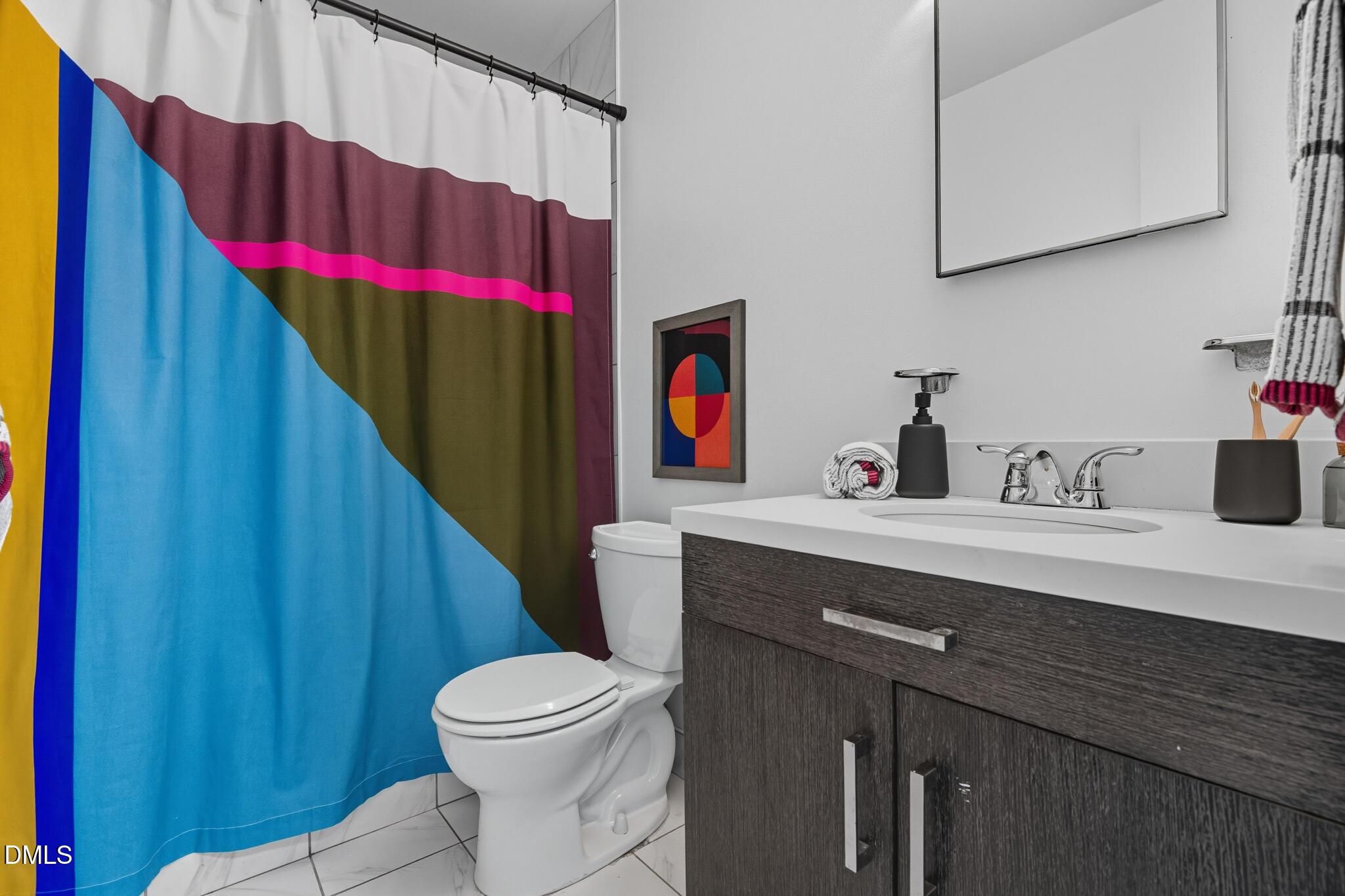 105 Fidelity Street, Unit B9 Carrboro, NC 27510 - Photo 29 of 50 a bathroom with a sink a toilet and shower curtain