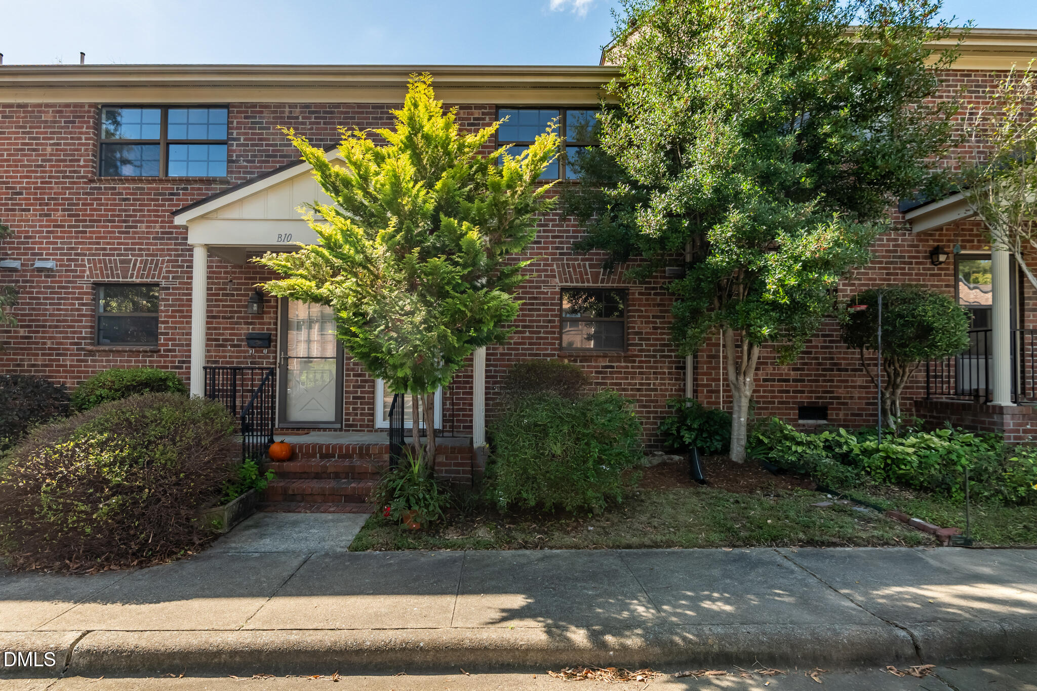 105 Fidelity Street, Unit B9 Carrboro, NC 27510 - Photo 2 of 50 a house that has a tree in front of it