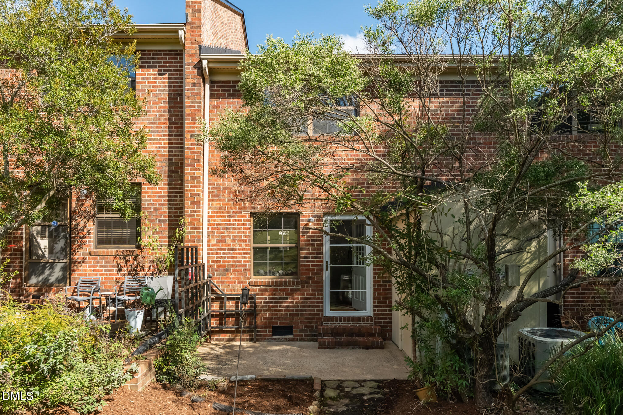 105 Fidelity Street, Unit B9 Carrboro, NC 27510 - Photo 39 of 50 a view of a brick house with a tree