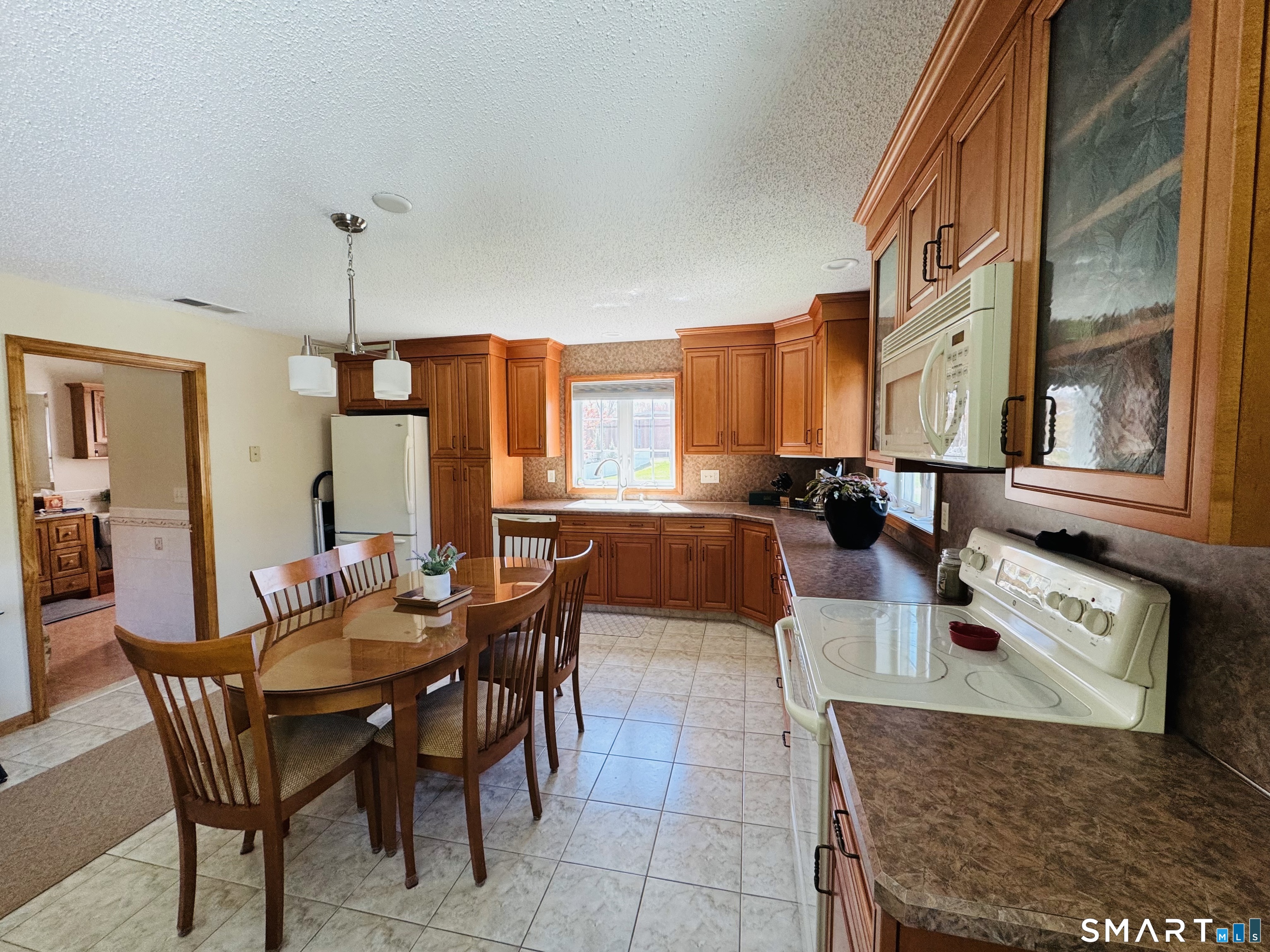 1514 Woodtick Road Wolcott, CT 06716 - Photo 19 of 23 a view of a dining room with furniture