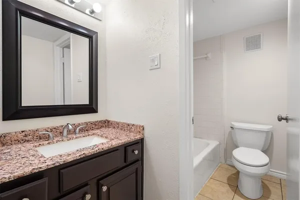 a view of a brick house with a large window