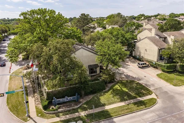 an aerial view of residential building with parking space