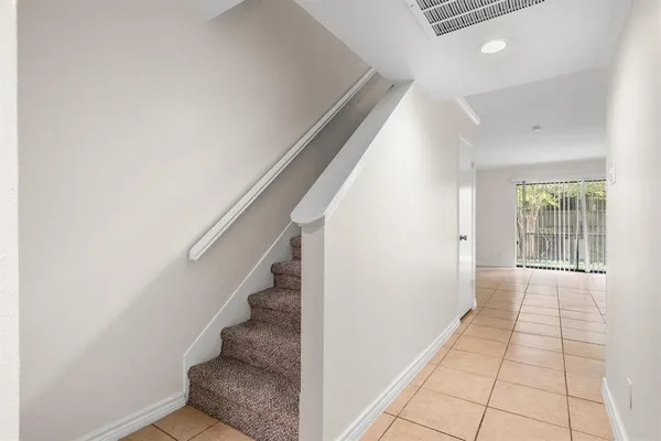 a view of an empty room and closet area