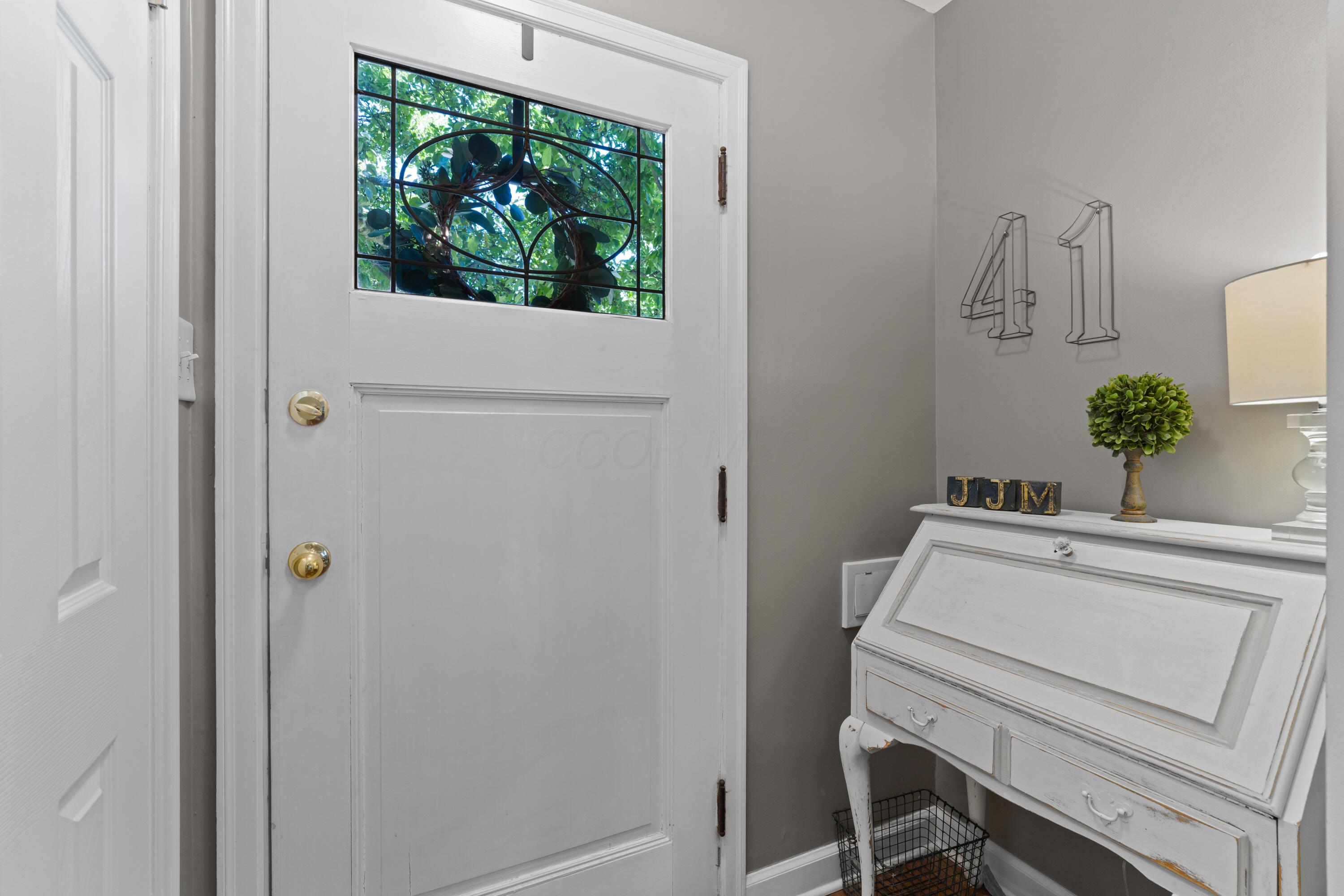 41 Aldrich Road Columbus, OH 43214 - Photo 5 of 52 Entry into Foyer with coat closet and mail slot, with views of the double archways and staircase