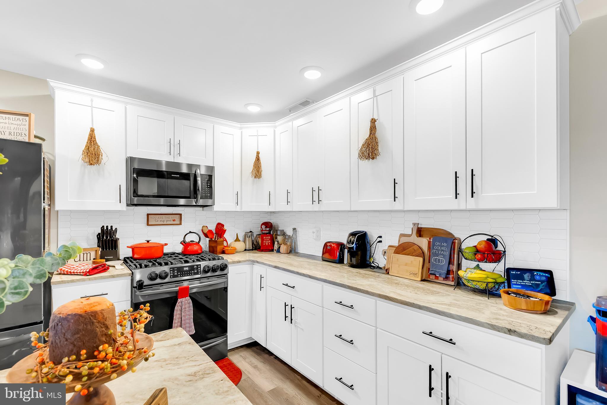 7829 New Hope Road Willards, MD 21874 - Photo 15 of 41 a kitchen with stainless steel appliances a stove refrigerator sink and cabinets